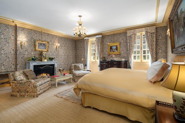 carpeted bedroom featuring a notable chandelier, ornamental molding, a high end fireplace, and wallpapered walls