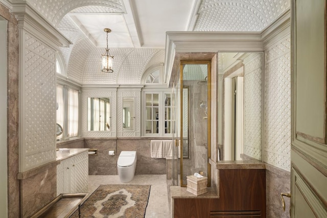 bathroom with vanity, ornamental molding, toilet, and walk in shower