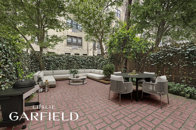 view of patio featuring an outdoor living space and grilling area