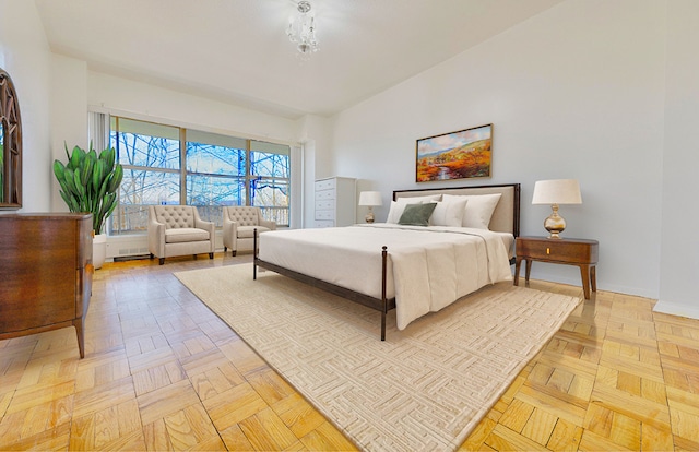 bedroom featuring light parquet flooring