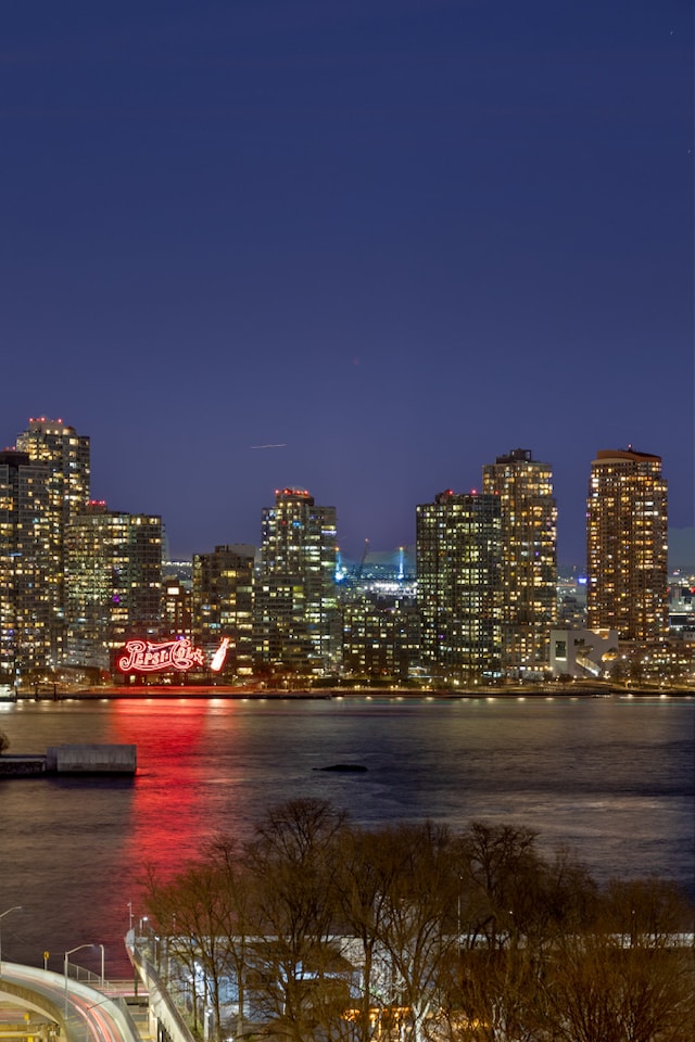 100 United Nations Plz Unit 20E, New York City, NY 10017 - water view featuring a view of city lights