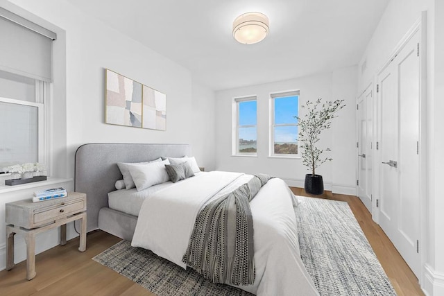 bedroom with light hardwood / wood-style flooring