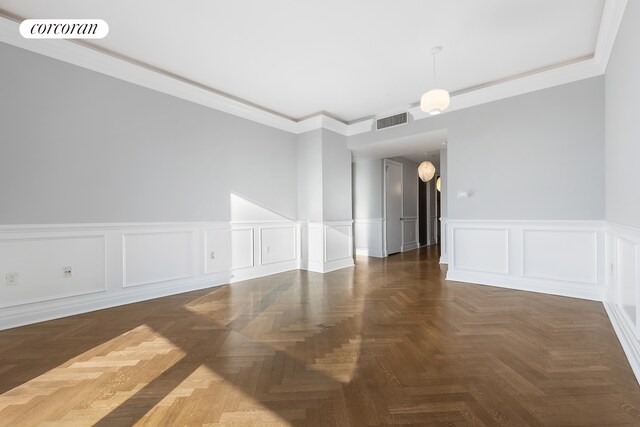 25 Columbus Cir Unit 55F, New York City, NY 10019 - empty room featuring a decorative wall, crown molding, and wainscoting