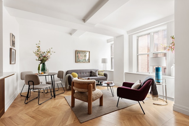 living room with beam ceiling and light parquet flooring