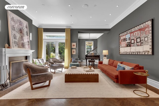 living room with ornamental molding and parquet floors