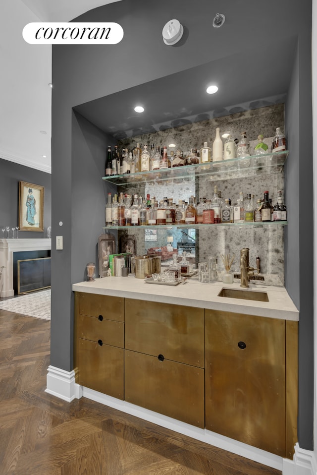 bar with indoor wet bar, recessed lighting, a fireplace, and a sink