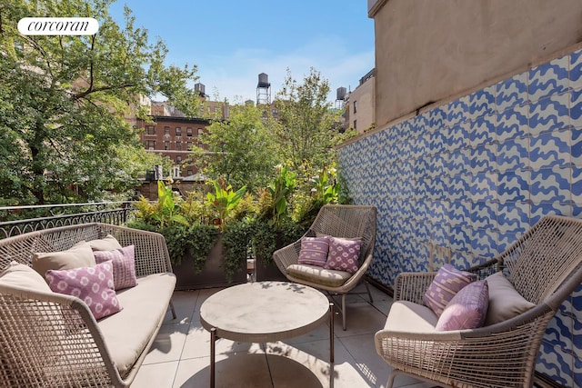 view of patio / terrace with an outdoor hangout area and a balcony