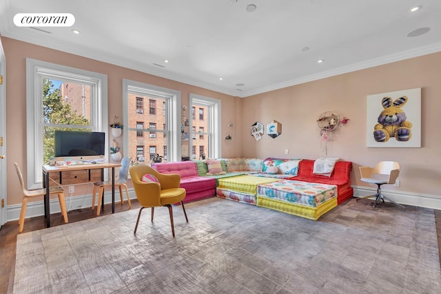 living area featuring visible vents, a baseboard heating unit, baseboards, ornamental molding, and recessed lighting