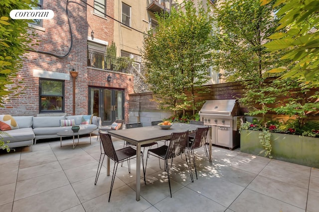 view of patio featuring grilling area, fence, an outdoor hangout area, french doors, and outdoor dining space