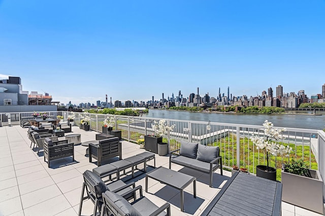 30-05 Vernon Blvd Unit 2-D, New York City, NY 11102 - view of patio / terrace featuring an outdoor hangout area, a skyline view, and a water view