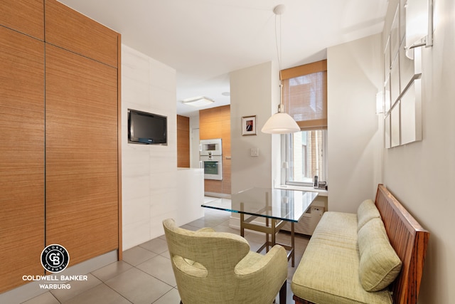 dining space with light tile patterned floors