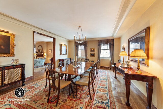 sitting room featuring hardwood / wood-style flooring and ornamental molding