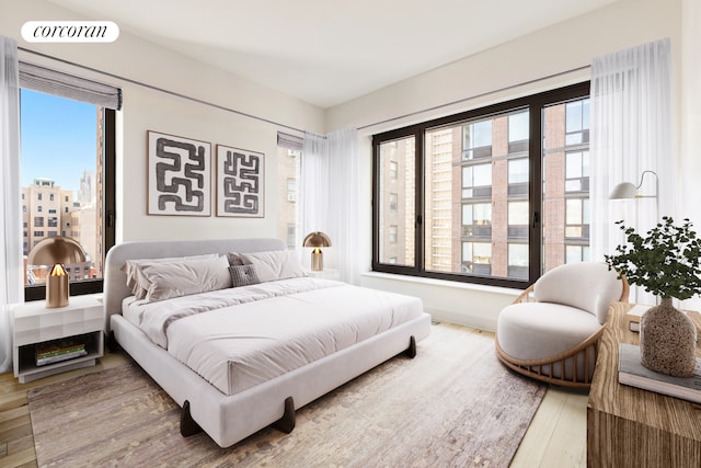 bedroom featuring visible vents and wood finished floors