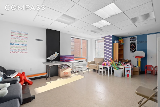 playroom with a drop ceiling