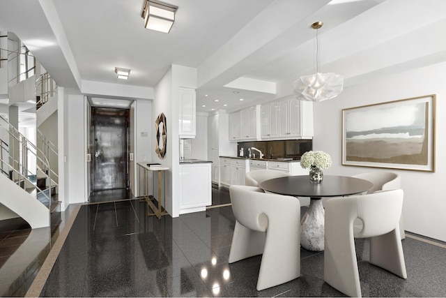 860 5th Ave Unit 7B, New York City, NY 10065 - dining area with stairs, granite floors, and baseboards