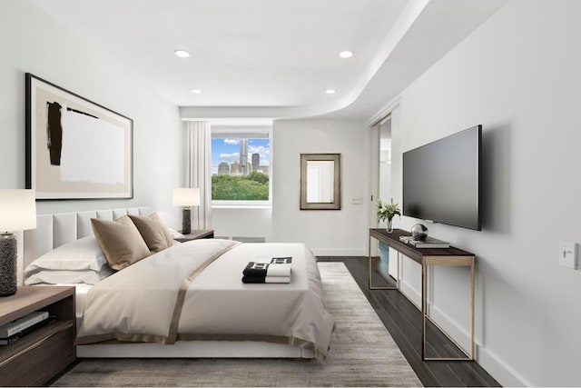 bedroom with dark wood-type flooring