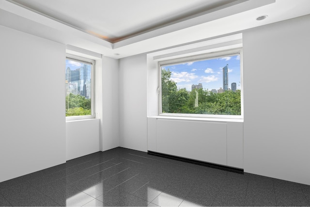 860 5th Ave Unit 7B, New York City, NY 10065 - empty room featuring a skyline view and granite floors