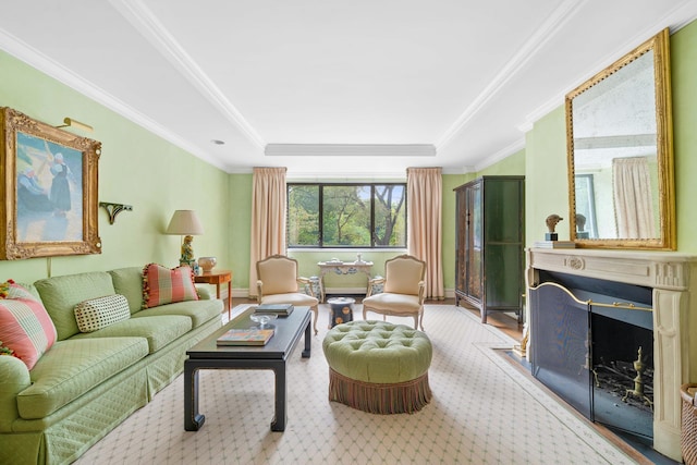 living room featuring crown molding, baseboards, a tray ceiling, a fireplace, and wood finished floors