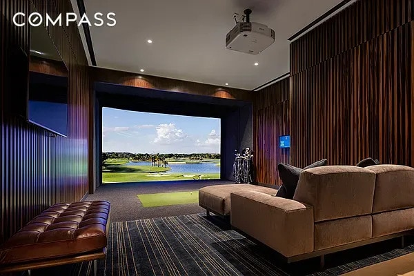 home theater room with carpet flooring, wood walls, and golf simulator