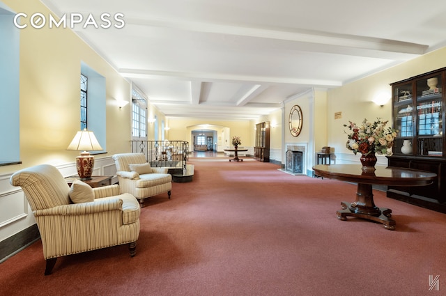 25-40 31st Ave Unit 6M, New York City, NY 11106 - community lobby with beamed ceiling, a decorative wall, and a wainscoted wall