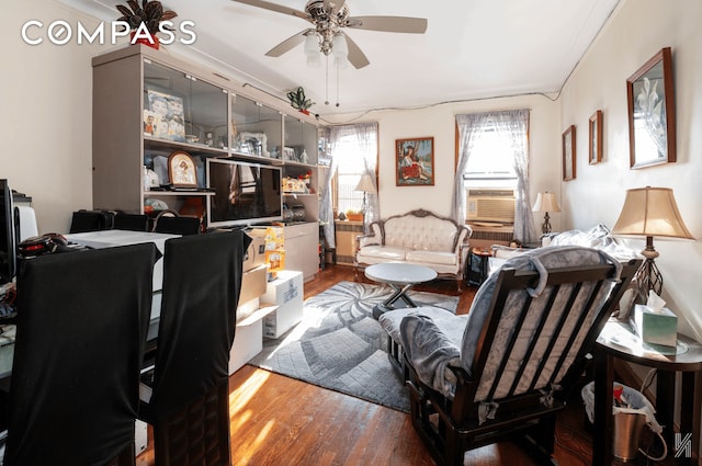 living area featuring ceiling fan and wood finished floors