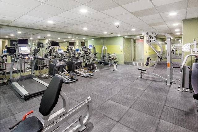 exercise room with a drop ceiling