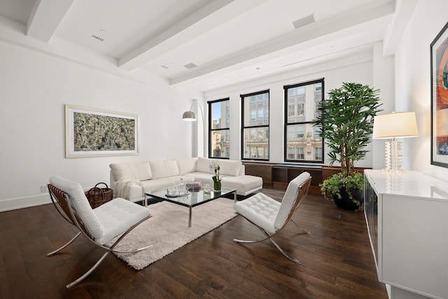 living room with visible vents, dark wood-type flooring, and beamed ceiling