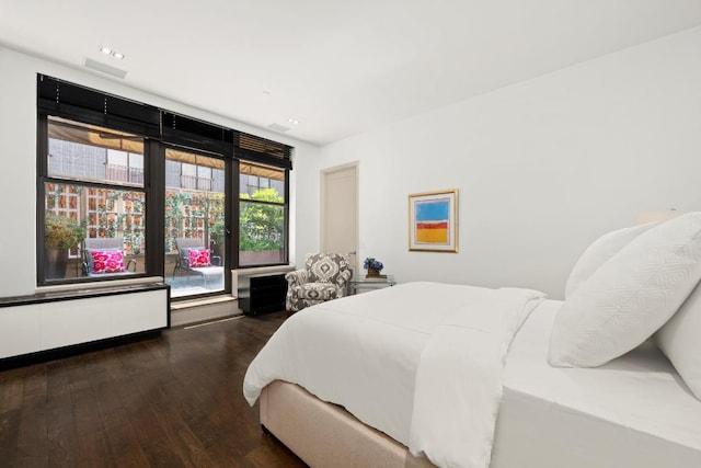 bedroom featuring dark hardwood / wood-style floors