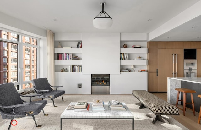 living room featuring built in shelves