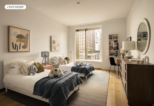 bedroom featuring light wood finished floors and visible vents