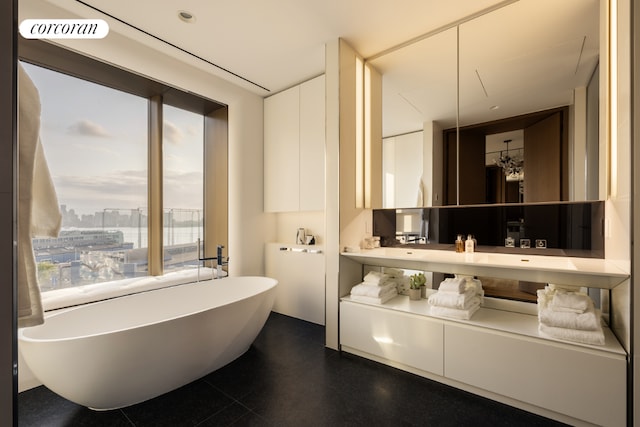 bathroom with a bathing tub and vanity