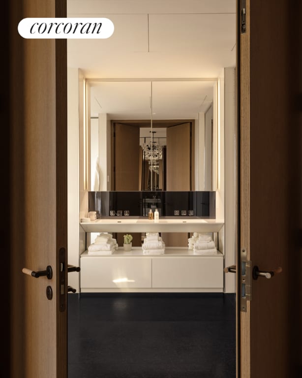 bathroom with vanity and a chandelier