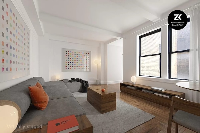 living room featuring beam ceiling