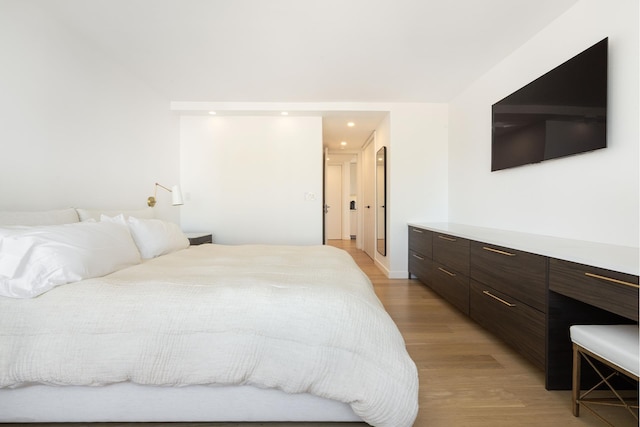 bedroom featuring recessed lighting and light wood-type flooring