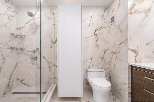 bathroom featuring a marble finish shower, stone wall, and vanity