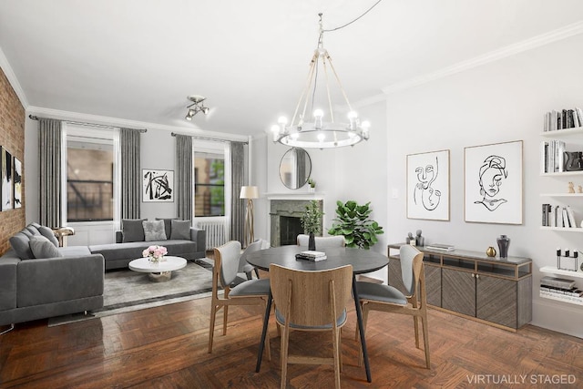 dining area with crown molding, dark parquet floors, and a notable chandelier