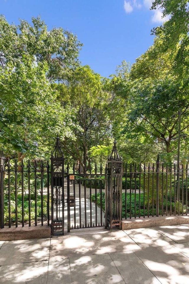 view of gate featuring fence