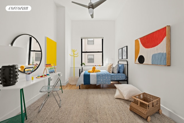 bedroom featuring visible vents, baseboards, and wood finished floors