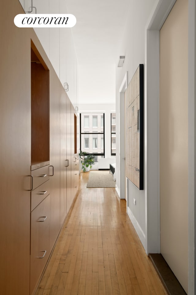 hallway with light wood-type flooring