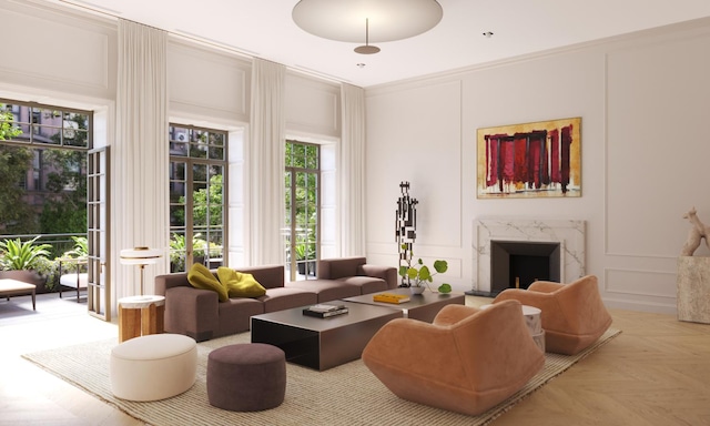 living area featuring crown molding, a premium fireplace, and a decorative wall