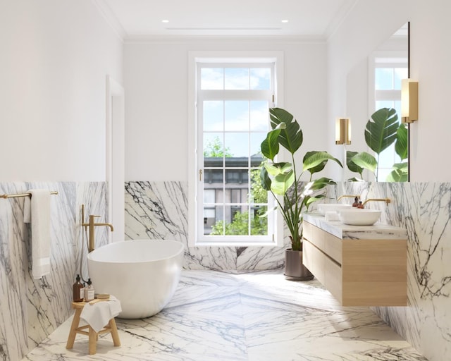 bathroom featuring double vanity, a soaking tub, marble finish floor, crown molding, and recessed lighting