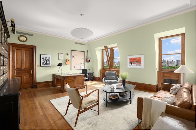 living room with crown molding, visible vents, and hardwood / wood-style flooring