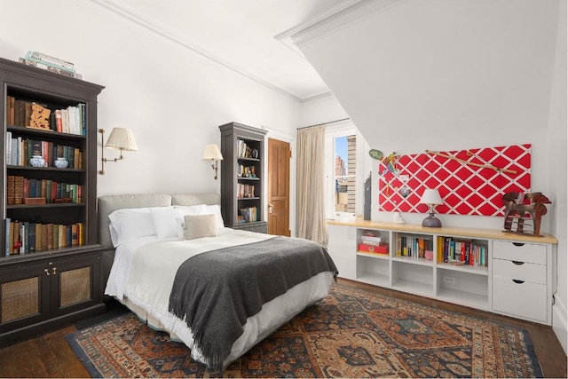 bedroom with crown molding and dark hardwood / wood-style floors