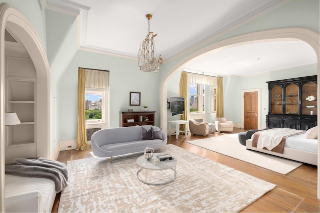 1 W 72nd St Unit 84, New York City, NY 10023 - bedroom featuring arched walkways, ornamental molding, wood finished floors, and baseboards