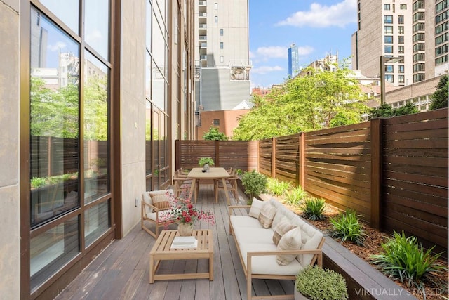 exterior space with outdoor dining area, a fenced backyard, and an outdoor living space