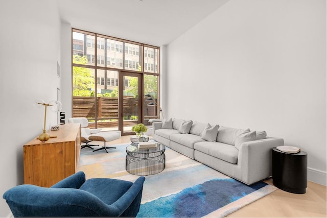 living area featuring floor to ceiling windows