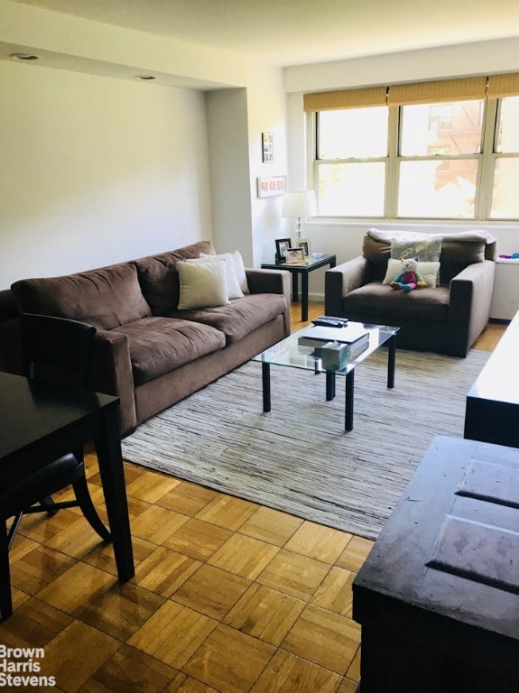 living room with parquet flooring