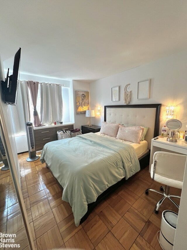 bedroom featuring parquet floors