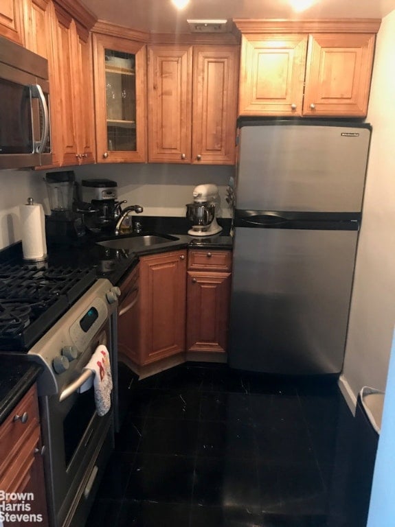 kitchen with sink and appliances with stainless steel finishes