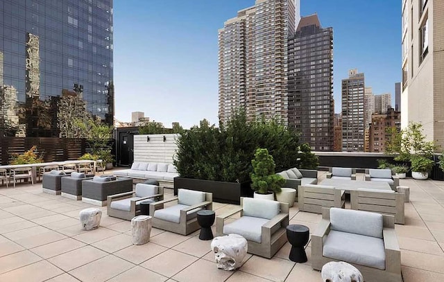 view of patio with a view of city and an outdoor hangout area